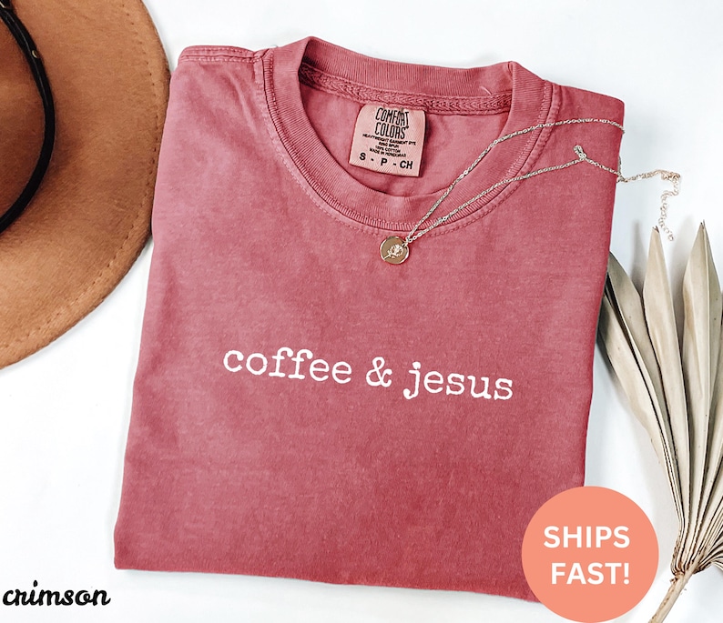 May include: Crimson red t-shirt with the text "coffee & jesus" in white lettering.