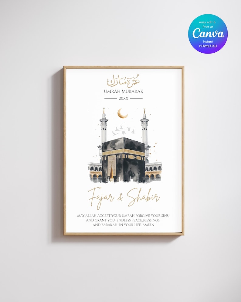 May include: A framed art print featuring a watercolor illustration of the Kaaba in Mecca. The artwork includes Arabic calligraphy and English text that reads "Umrah Mubarak" and "Fajar & Shabir". The print has a gold frame and a white background.