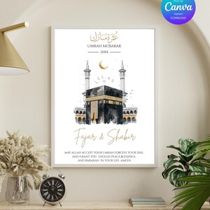 May include: A framed Umrah Mubarak print featuring a watercolor illustration of the Kaaba, with gold accents and Arabic calligraphy. The print includes the names "Fajar & Shabir" and a prayer. The Canva logo is visible in the upper right corner.