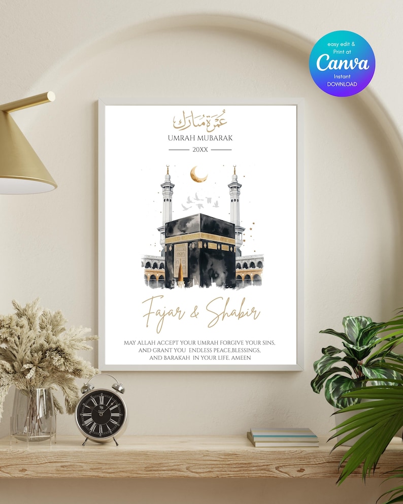 May include: A framed Umrah Mubarak print featuring a watercolor illustration of the Kaaba, with gold accents and Arabic calligraphy. The print includes the names "Fajar & Shabir" and a prayer. The Canva logo is visible in the upper right corner.