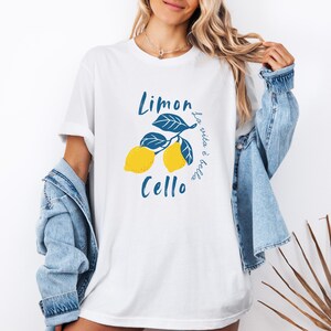 White Comfort Colors unisex shirt with yellow lemons and navy blue leaves, featuring “Limoncello” text and “La vita è bella” in script.