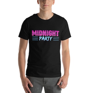 May include: Black t-shirt with a pink and blue graphic that says "MIDNIGHT PARTY" with three blue lines above and below the text.