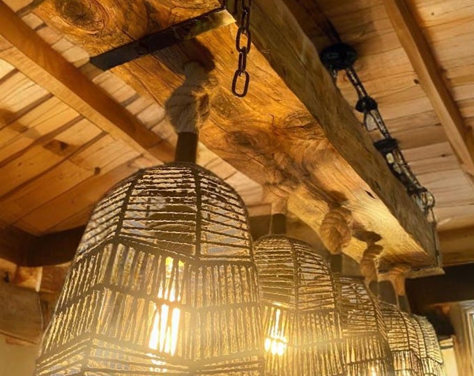 Rustic beam ceiling light from reclaimed timber complete with hemp rope pendants and vintage black cages, waxed in oak with steel brackets