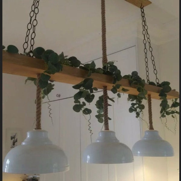 Beautiful large wooden beam ceiling light with 3 rope light pendants with vintage industrial  metal lamp shades to match kitchen island