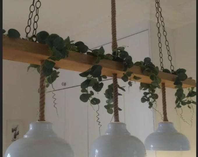 large wooden beam ceiling light with 3 rope pendants with vintage industrial  metal lamp shades to match kitchen island breakfast bar