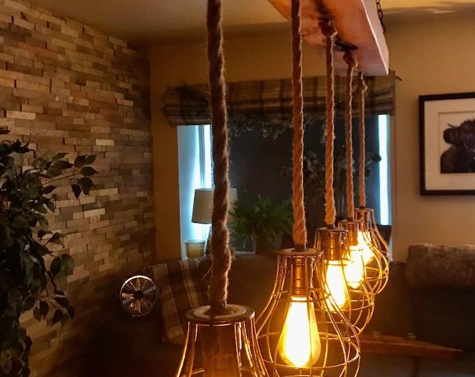 Rustic handmade wooden beam pendant rope light with Edison bulb holders and brushed copper cages, ceiling mounted  solid wood oak waxed