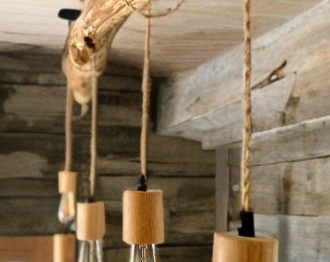 Rustic pendant chandelier light made from reclaimed wooden branches with wooden Edison bulb holders natural lighting