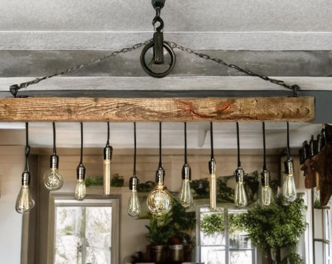 Rustic wooden beam light with vintage pendant Edison bulb holders hung from black chain and pulley, waxed in oak complete with ceiling hooks