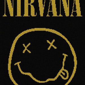 Op de afbeelding: Een zwart en geel geborduurd patch met het woord "NIRVANA" in hoofdletters en een gele smiley met twee X-en voor ogen.