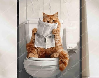 May include: A framed wall art print featuring a fluffy orange cat sitting on a white toilet, holding an open newspaper in front of its face. The background shows a tiled bathroom wall with a toilet paper roll holder mounted to the right side.