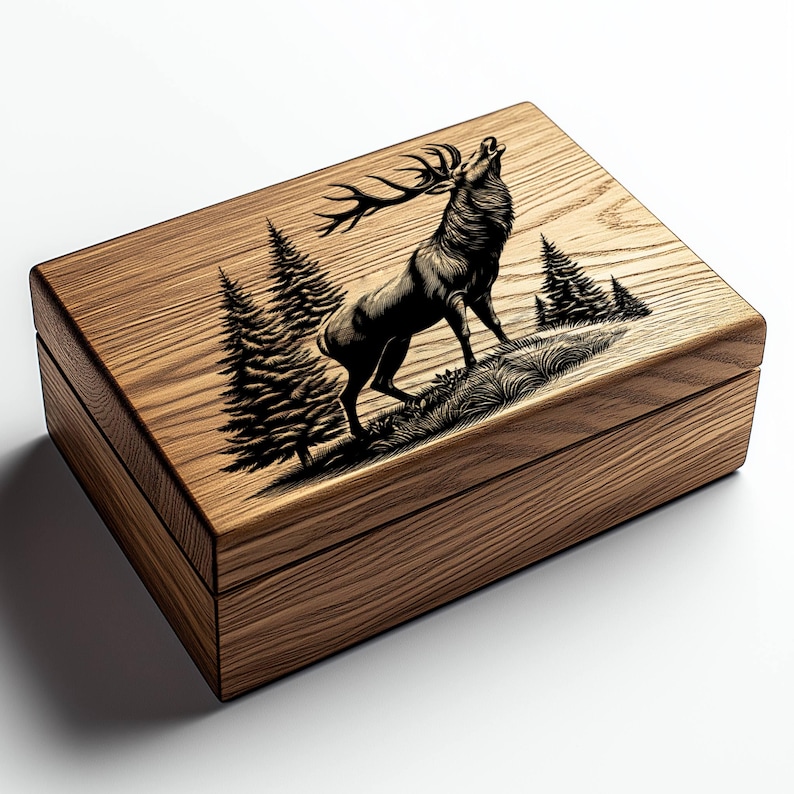 May include: A wooden box with a hinged lid. The lid is decorated with a laser-engraved image of a stag standing in a forest. The stag is facing right and has its head tilted back, as if it is calling out. The forest is made up of pine trees.