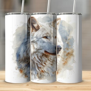 May include: White wolf with blue and brown watercolor background on a white stainless steel tumbler.