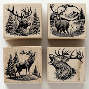 May include: Four wooden blocks with black and white illustrations of a stag or deer in a forest setting. The stag is depicted in various poses, including standing, walking, and roaring.