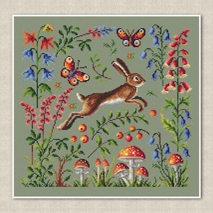 May include: A cross-stitch pattern featuring a brown rabbit hopping through a green meadow with red, blue, and white flowers, butterflies, and mushrooms.