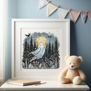 May include: A framed cross-stitch artwork featuring a whimsical ghost in a forest setting under a full moon. The artwork is in a white frame and includes bats, stars, and stylized trees. A teddy bear sits nearby.