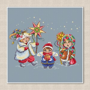 Schema punto croce cantori di Natale, disegno stella di Natale, arte della tradizione popolare ucraina, decorazioni natalizie, PDF digitale scaricabile immediatamente