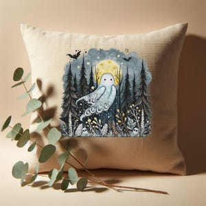 May include: Beige linen pillow with a cross-stitch design featuring a whimsical ghost in a forest setting. The design includes a full moon, bats, and stylized trees, creating a spooky yet charming aesthetic.