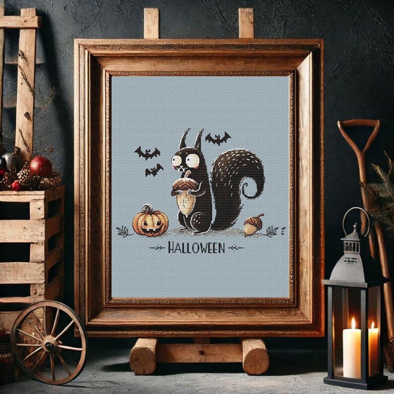 May include: A framed Halloween-themed print features a cartoon squirrel holding an acorn, with a jack-o'-lantern and bats. The text "HALLOWEEN" is below the squirrel. The print is in a wooden frame.