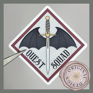 May include: A white diamond-shaped sticker with a red border. The sticker features a black bat with wings spread wide, a gold sword with a red jewel, and the text "QUEST SQUAD".