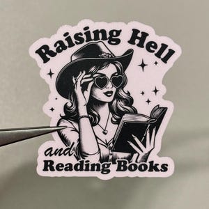 Adesivo "Raising Hell & Reading Books"