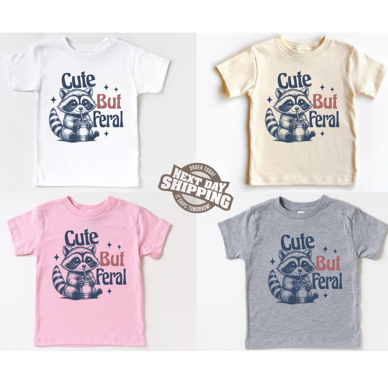 May include: Four toddler t-shirts with a cute raccoon graphic and the text "Cute But Feral". The shirts are in white, beige, pink, and gray.
