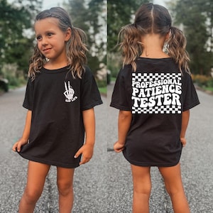 Camiseta de probador de paciencia profesional, camiseta divertida para niños pequeños, camiseta para niños con diseño de dos lados, camiseta con mano de esqueleto para niños, camiseta de probador de paciencia para niñas