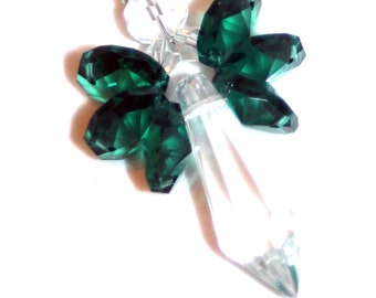 May include: A car charm with a silver charm that reads "Never drive faster than your Guardian Angel can fly" and a crystal pendant with green crystal wings.