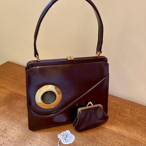 Vintage 1970s top handle Lodix handbag with gem motif and matching purse deep red conker brown
