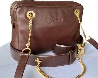 Bolso de hombro vintage Paloma Picasso de piel color ciruela con cadena dorada
