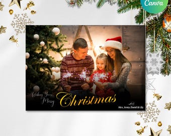 May include: A Christmas card featuring a family holding sparklers in front of a Christmas tree. The card has the text "Wishing You a Merry Christmas" in gold script, with the names Alex, Jenny, Daniel & Lily.