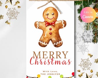 May include: A white Christmas gift tag featuring a watercolor gingerbread man with a red bow tie and buttons. The tag reads "MERRY Christmas" in red script, with a string of colorful lights at the bottom.