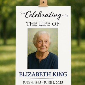 May include: A memorial sign on an easel with the text "Celebrating THE LIFE OF ELIZABETH KING JULY 4, 1945 - JUNE 1, 2025". The sign features a photo of an elderly woman. The background is a blurred green.
