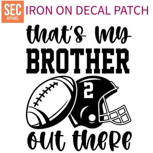 May include: Black and white iron-on decal patch with the text "that's my brother out there" and a football and helmet graphic.