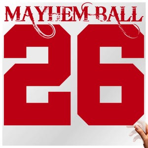May include: A red and white graphic with the words "MAYHEM BALL" at the top and the number "26" in a bold, red font. The design has a distressed, vintage look.