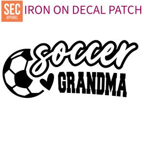 May include: Black and white iron-on decal patch with a soccer ball and the text "soccer grandma" with a heart symbol.