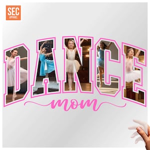 May include: A white graphic featuring the word "DANCE" in pink, with images of young dancers within each letter. The word "mom" is written in pink script below "DANCE". The SEC Apparel logo is in the top left corner.