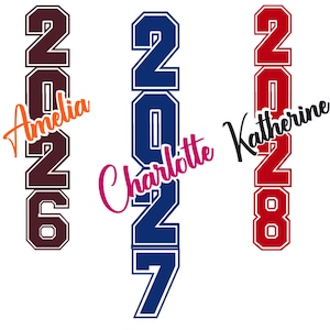 May include: Three vertical designs with the numbers 2026, 2027, and 2028 in maroon, navy blue, and red, respectively. Each design includes a name in a script font: Amelia, Charlotte, and Katherine. The designs are for graduation.