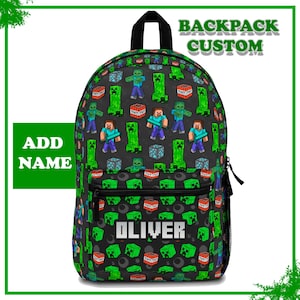 May include: A black backpack with a Minecraft-themed pattern featuring green Creepers, Steve characters, TNT blocks, and other game elements. The name "OLIVER" is displayed in white block letters on the front pocket. The words "BACKPACK CUSTOM" are at the top.