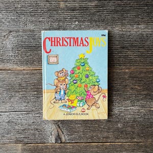 Christmas Joys by Kathleen Daly A Junior Elf Book 1988 Children’s Picture Book Illustrated by Mary McClain