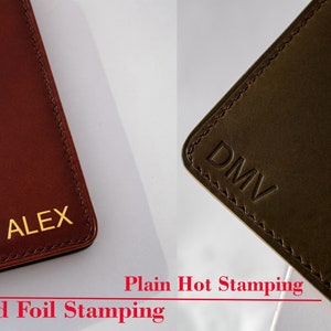 May include: Two leather wallets with different types of personalization. The wallet on the left has "ALEX" embossed in gold foil. The wallet on the right has "DMV" embossed in a plain hot stamping style. The text "Gold Foil Stamping" is below the left wallet and "Plain Hot Stamping" is below the right wallet.