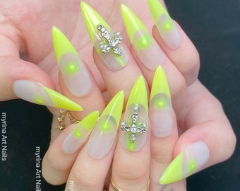 Fluorescent yellow nails,water drop pointed nails,almond nails,cross diamond nails,french nails