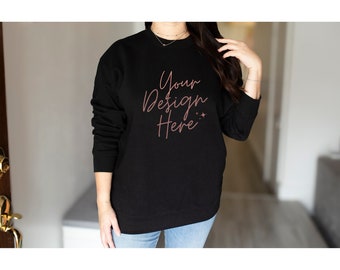 May include: A black sweatshirt with the text "Your Design Here" in pink script on the front.