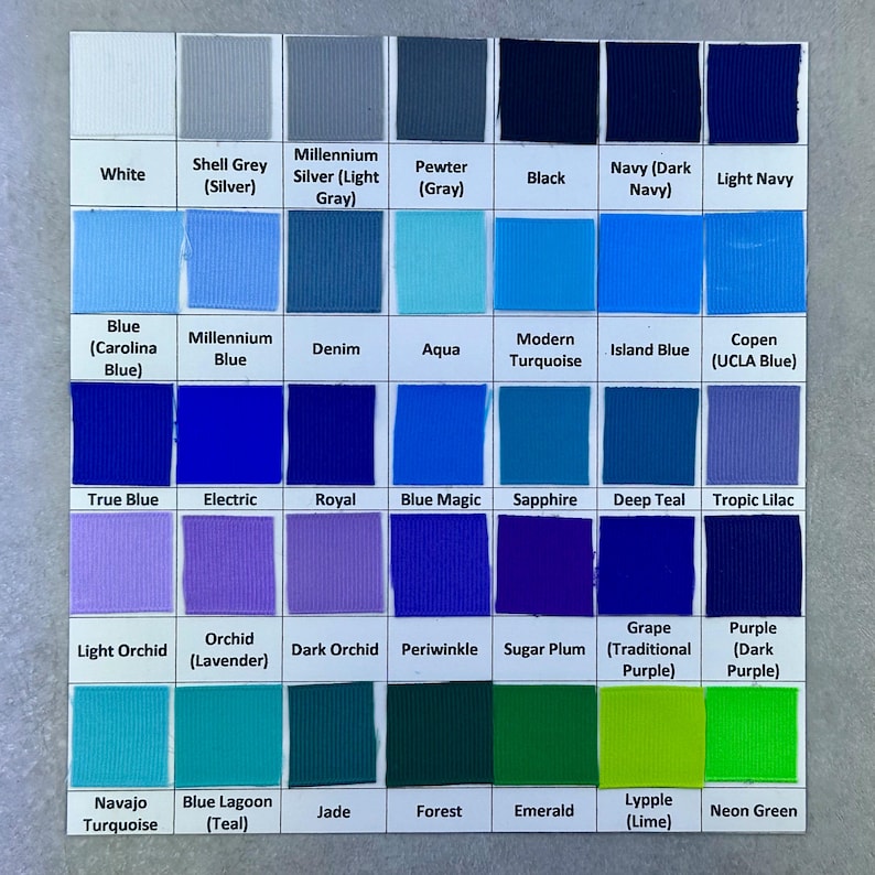 May include: A colour chart displaying ribbon swatches in a range of hues, including white, grey, blue, purple, and green. Each colour is labelled, with names such as 'Navy,' 'Royal,' and 'Neon Green.' The chart is organised in a grid.