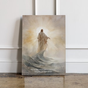 May include: Canvas art print depicting a figure in flowing robes standing on water, with a bright light emanating from behind. The artwork features a soft color palette and includes the text: "May the light of God shine in your heart and guide your steps always."