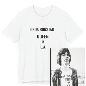 May include: White t-shirt with black text that reads "Linda Ronstadt Queen of L.A."