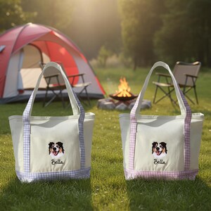 May include: Two off-white canvas tote bags featuring an embroidered Australian Shepherd dog face and the name Bella in black script. Each bag has light purple or pink gingham patterned fabric trim on the handles and base.