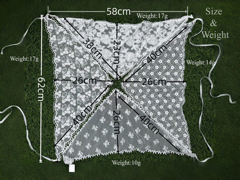May include: White lace shawl with floral patterns, measuring 62cm in length and 58cm wide. The shawl is composed of four triangular sections, each with a 40cm side. The weight of the shawl is 17g, 17g, 14g and 10g.