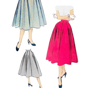 May include: Illustration of three flared skirts in different colours: light blue, hot pink, and grey. The skirts are shown with a waist measurement of 28 inches (71 cm). The text "Paper Ladies Patterns" is displayed in a navy blue script.