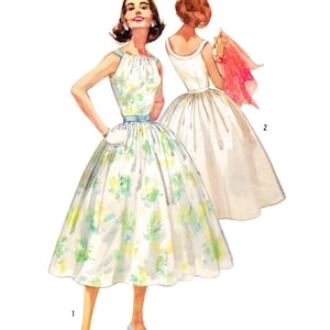 May include: Vintage dressmaking pattern illustration. The image shows two women in dresses. The first dress is white with a floral pattern, a blue belt, and a halter neckline. The second dress is white with a simple neckline. Text at the top reads "Paper Ladies Patterns". Bust 86cm.