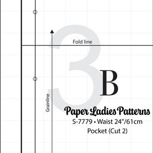 May include: A black and white sewing pattern for a pocket. The pattern is labeled "Paper Ladies Patterns" with the style number "S-7779" and a waist size of 24 inches or 61 centimeters. The pattern is labeled "Pocket (Cut 2)".